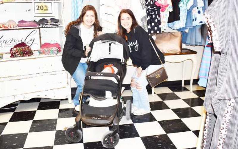 SHOPPING WITH BABY - Pictured are Ashton White, Allie Loewrigkeit and baby at Studio K on Saturday. Studio K participated in the Rise, Shine and Shop event on the Levelland Square where customers could eat brunch while browsing various shops. (Staff photo by Ada Niederhauser)