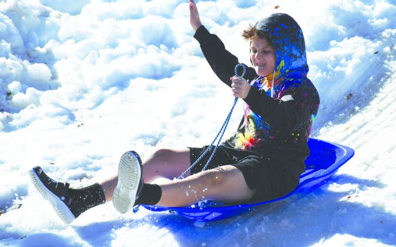 TRY IT WHILE IT LASTS - The Lobo Lake Sled Hill will only be available to the public until the majority of the snow is gone. The community is encouraged to bring their children sooner than later to enjoy the six different sled trails while the conditions are still considered excellent. (Staff Photo)