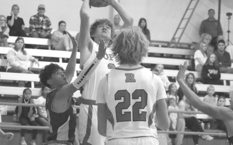 TOUGH SHOT - Ropes athlete Kade Franklin made the tough shot over Whiteface guard Chris Olguin to extend Ropes lead last Monday. (Staff photo by Aalijah Soliz)