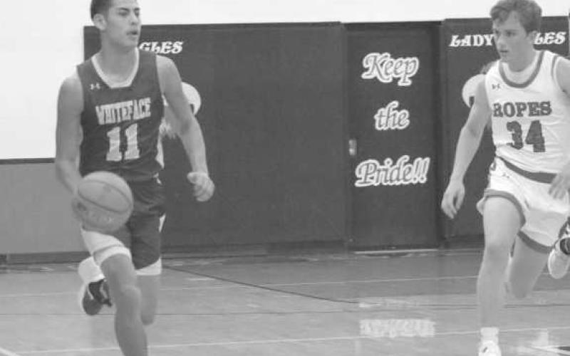 PRESS - Whiteface athlete Jeremias Chavez took the ball down the court to get around the Ropes Eagles full court press. (Staff photo by Aalijah Soliz)