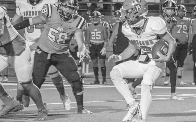 CUTBACK LANE - Sundown Roughneck Breyson Frey cut back with the ball against the Wink Wildcats in Odessa for the team’s last game. (Staff photo by Aalijah Soliz)