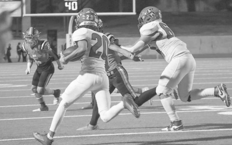 GET THE CORNER - Sundown Roughneck Briar Miller tried turning the corner with a blocker during the team’s last game of the season against Wink. (Staff photo by Aalijah Soliz)