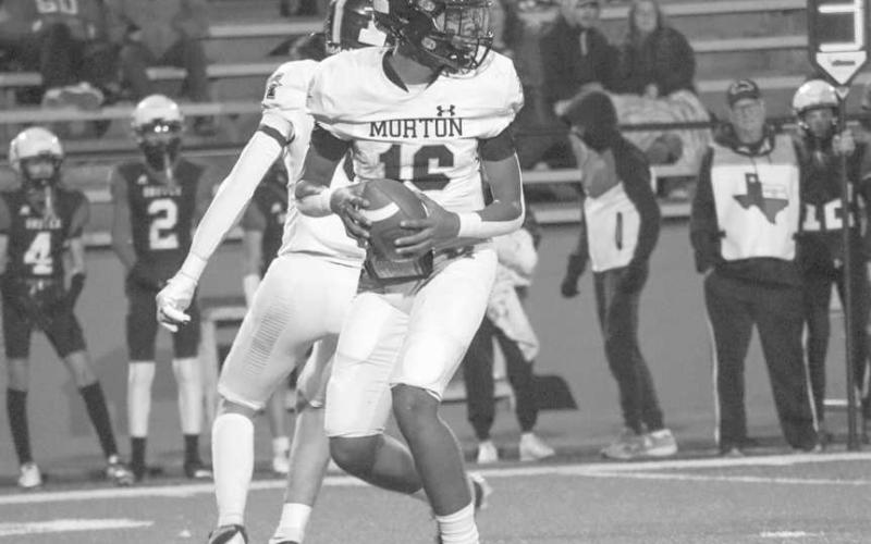 MAKE THE READ - Morton Indian Brayden Villarreal got the snap and looked down field in the team’s contest against Gruver in Amarillo. (Staff photo by Aalijah Soliz)