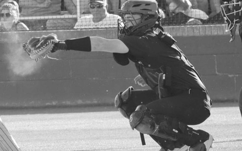STRIKE - Morton Indian Cade Lyon caught a strike from his brother Lane Lyon during the team’s last game of the season against the Ira Bulldogs in Lubbock. (Staff photo by Aalijah Soliz)