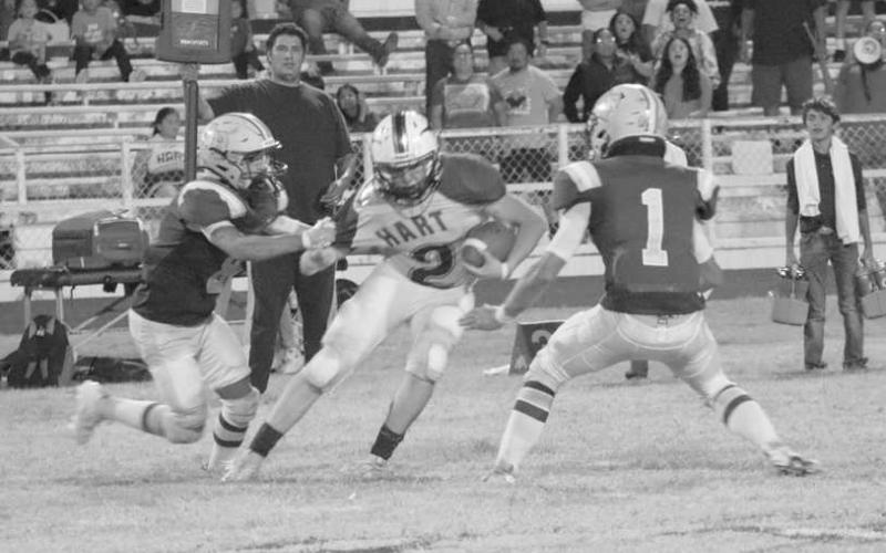 FLYING TO THE BALL - The Anton Bulldog defense was making plays all around the field, making the Hart Longhorns offense work for their yards. The Bulldogs started district play this Friday against the Kress Kangaroos as the away team. (Staff photo by Aalijah Soliz)