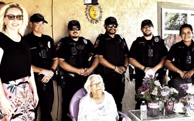 Happy 100th Birthday - Marking another City of Levelland Centennial year moment, Levelland Police Department officers and Mayor Breann Buxkemper joined Margarita Estrada in celebrating her own Centennial birthday. Estrada was presented with a plaque, flowers and gifts in honor of her life and contributions to the community, her family and friends. (Staff Photo by C. R Calhoun)