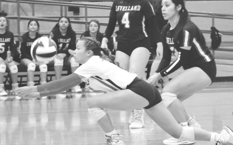 DIVE - Levelland Libero Aubree Gaona dove for the pop up to set her teammates up to finish off the point during the game this past Monday. (Staff photo by Aalijah Soliz)