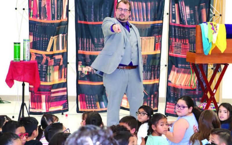 MAGIC AND READING- The Hockley County Library Summer Program kicked off on Wednesday with Magic by Bronson. He taught the children about the importance of reading by using magic tricks. Pictured is Bronson Chadwick.(Staff photo by Emily Campos)