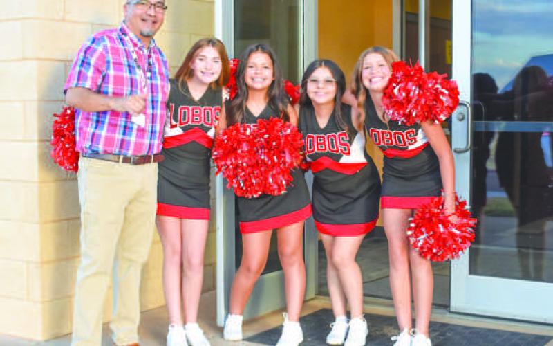 Levelland ISD started school on Thursday with some Lobo spirit from the cheer squad. The Levelland Middle School welcomed students back with some Lobo cheer and teacher hand shakes. Pictured is teacher Martin Torrez and students Kaydence Navarro, Xara Marquez, Katie Bunker, Hollyn Howard and Carley Gonzalez.(Photo Emily Campos)
