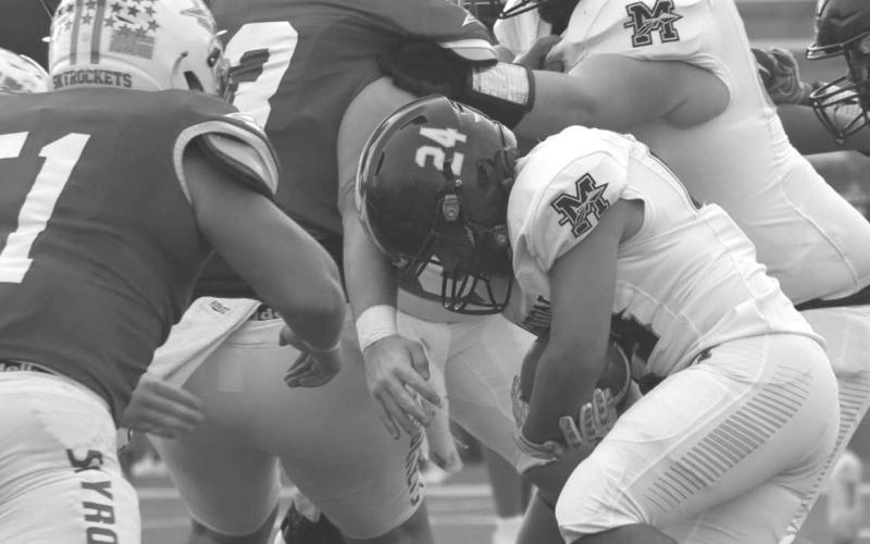 TOUGH RUNNING - Morton running back Christain Enriquez ran the ball right up the middle during the teams playoff loss to the Wellington Skyrockets last Thursday. The Indians finished their season as Bi-District Champions against the Lockney Longhorns. (Staff photo by Aalijah Soliz)