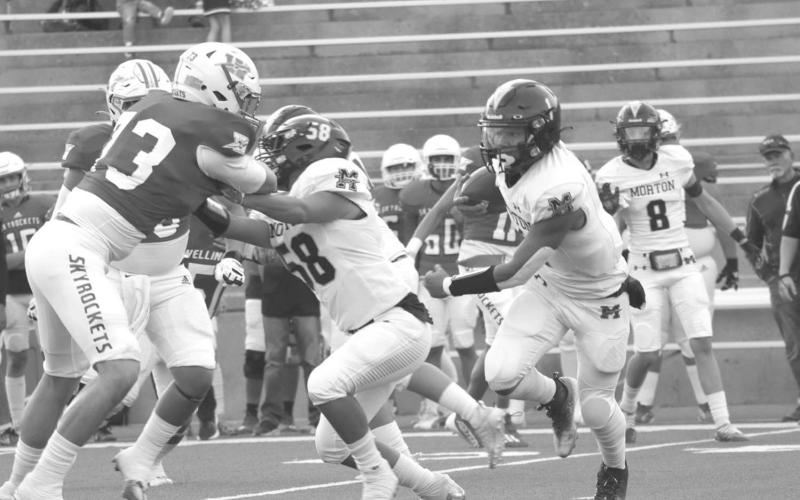 QB RUN - Morton Indians quarterback Dante Chavez ran the ball around the Skyrocket defense during the teams game in Canyon last Thursday. (Staff photo by Aalijah Soliz)