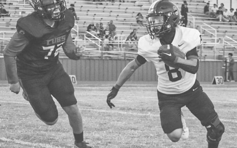 TOO FAST - Levelland Lobo Ricky Rodriguez outran the defensive lineman last Friday in the team’s contest against the Brownfield Cubs on the road. (Staff photo by Aalijah Soliz)