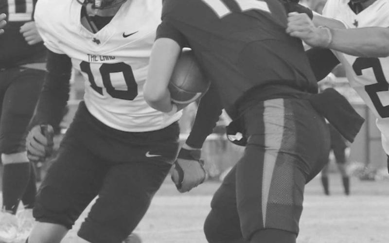 CHASED DOWN - Levelland Lobos Noah Tienda and Gage French chased down the Brownfield running back last Friday on the road in the team’s win. (Staff photo by Aalijah Soliz)