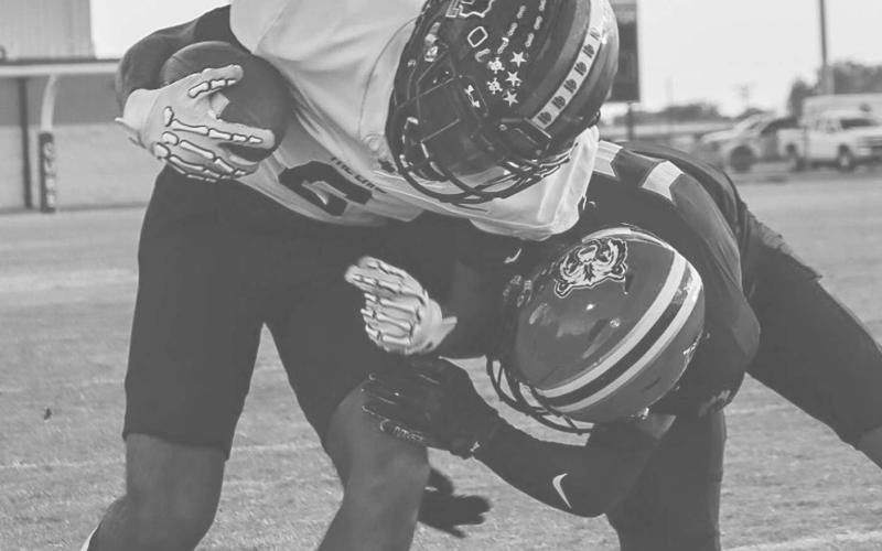 CAN’T BRING ME DOWN - Levelland Lobo Eryk Jones trucked the Brownfield defender during the team’s contest last Friday on the road in their big win. (Staff photo by Aalijah Soliz)