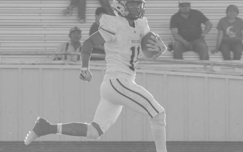 TOUCHDOWN - Jose Avalos ran down the sideline with the ball for the touchdown last Friday night against the Dawson Dragons in the teams win. (Staff photo by Aalijah Soliz)