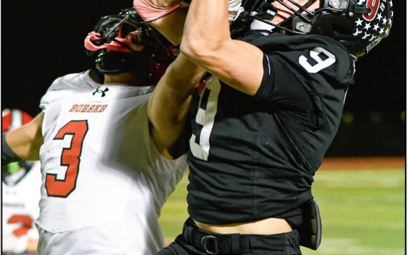 CONTESTED CATCH - Levelland senior running back Matthew Gullien goes up for the contested catch over a Borger defender during a football game this past Friday night at Lobo Stadium. (Staff photo by Jentezen Smith)