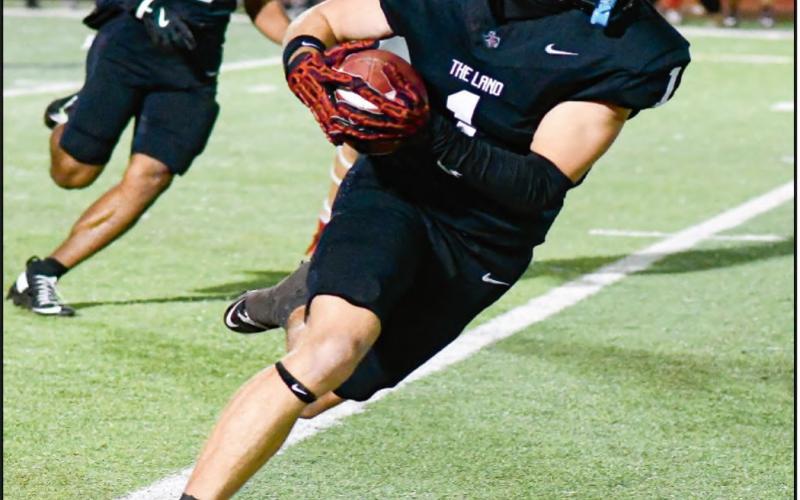 CATCH &amp;amp; RUN - Levelland senior wide receiver Kaden Brogden catches a pass and runs for extra yards as teammate Bryson Golightly goes to block during their game against Borger this past Friday night at Lobo Stadium. Brogden would catch a 41-yard touchdown in the game. (Staff photo by Jentezen Smith)