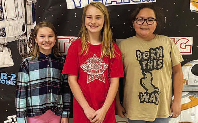 UIL READY WRITING– Levelland Intermediate School fourth grade students earned a Silver Medal after competing in Academic UIL in Big Spring recently. Pictured from the left are LIS fourth grade Ready Writing team members: Hattie Niederhauser placed fifth; Roxie Hall and Miracle Garcia. LIS fourth grade UIL teams placed second overall out of nine teams, under the direction of UIL Chair Katie Pena. (Submitted Photo)