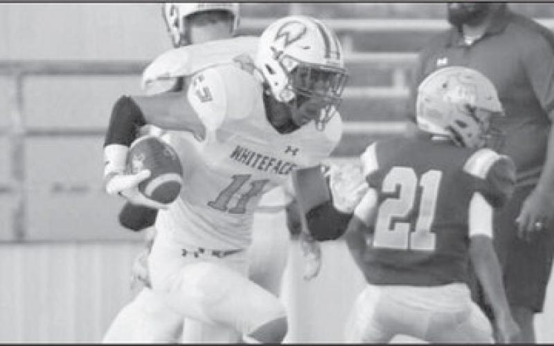 RUN PLAY - Jeremias Chavez had a 45-yard touchdown on the opening kickoff in a 60-0 Whiteface road win over the Anton Bulldogs last Friday in UIL Class 1A 6-man high school football action. Whiteface hosts Wildorado for homecoming at 7:30 this Friday while Anton heads to Spur for a 7:30 game. (Photo by Holly Crutcher)