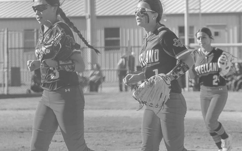 LOCKDOWN DEFENSE - Levelland Loboettes Saydi Mendez and Jazlyn Diaz jogged off the field after Diaz secured a pop fly in right field to get their defense off the field against the Sweetwater Lady Mustangs this past Tuesday. The Loboettes improve to 1-0 in distict play after their convincing win against the Lady Mustangs. The Loboettes improve to 10-11 on the season. (Staff photo by Aalijah Soliz)