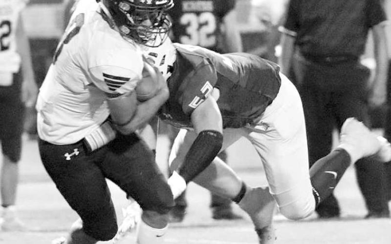 HARD HITTING- Brighton Scoggins put a hard hit on a Kress runner in a 58-50 home loss for the Whiteface Antelopes in UIL high school six-man football action last Friday. The Antelopes host Springlake-Earth on Friday at 7:30 p.m. They will also honor area first responders. (Photo courtesy of Holly Crutcher)