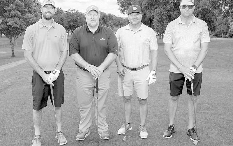 FLIGHT TWO THIRD PLACE- The team representing Wilbur-Ellis finished in third place at the SPC Scholarship Scramble. Shown from L-R are: Nathan Foster, Andy Neeb, Dusty Parker and Justin Garrett. (Photo by R&amp;amp;P Photographers)