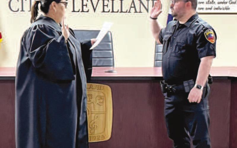ADDINGA NEW OFFICER - New members of the Levelland Police Department were sworn-in Wednesday morning at City Hall. Pictured is Cory Painter being sworn-in as a the newest officer for the LPD. (Photo courtesy of LPD)