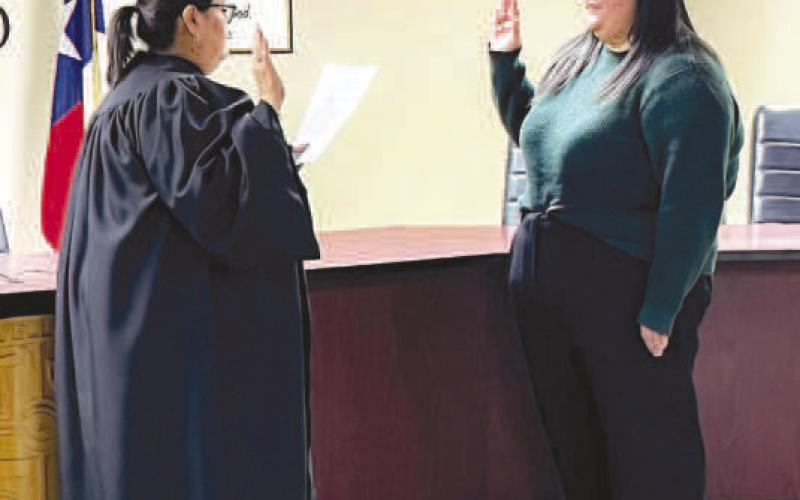 SWEARING IN NEW ANIMAL CONTROL MANAGER - New members of the Levelland Police Department were sworn-in Wednesday morning. Pictured is Macie Cole being sworn-in as Animal Control Manager. Telecommunications also received new member as Melissa Kelley was sworn-in for dispatch. (Photo courtesy of LPD)