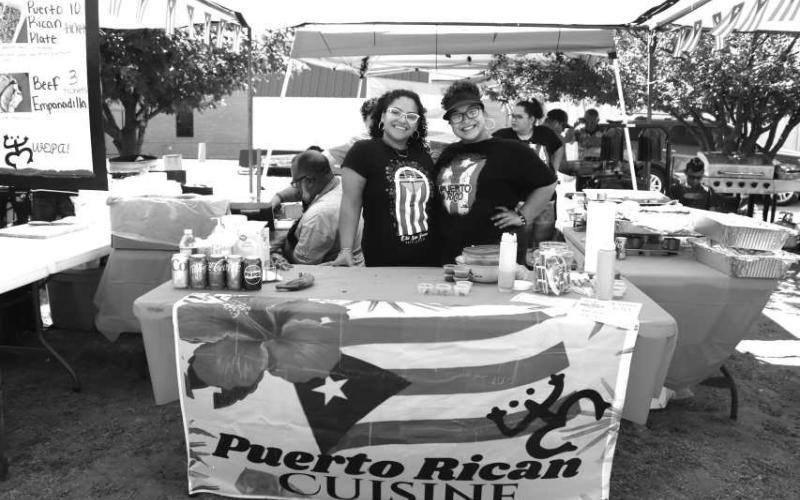 A TASTE OF PUERTO RICAN CUISINE - Puerto Rican Cusine was one of the many vendors that participated in the St. Michael’s Catholic Church 2024 Jamaica on Sunday. The commuinity was able to taste a little bit of food from many vendors. Pictured are Tiana Rodriguez and Ariana Salinas. (Photo courtesy of Emily Campos)