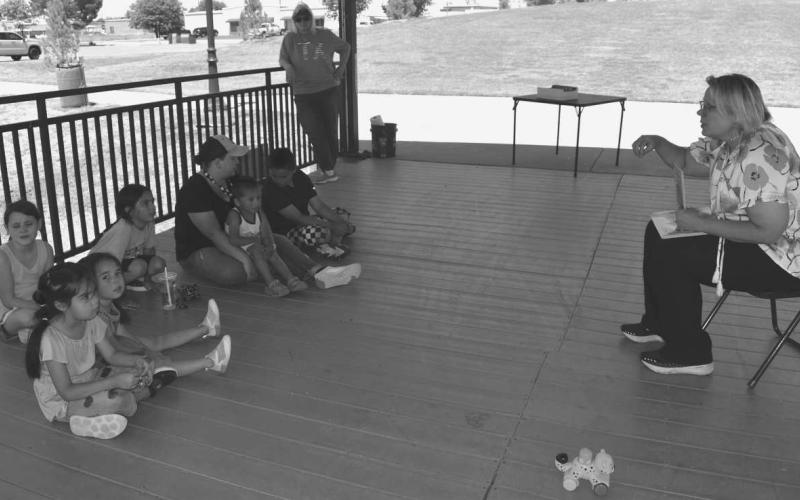 EARTH DAY- The Homeschool Association had a earth day activity at the Lobo Park On Tuesday. With the Help Of Kelly Hancock from the Chamber of Commerce who read a book about how bee’s pollinate and how plants are great for the bee’s. Pictured is Kelly Hancock, Donna Wheeler, Chloe Powell, Aria Mott, Zoe mott, Kaia Mott, Liam Mott, Lelo Perez Joshua Perez. (Staff photo by Emily Campos)
