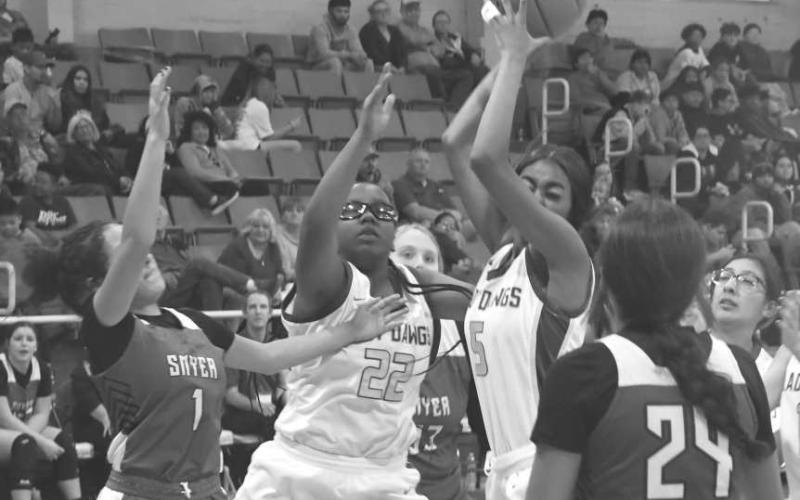 PHYSICAL - Anton’s Tatiana Collins got a rebound in a 61-22 second-round loss to the Smyer Lady Cats at the Anton Classic High School Basketball Tournament last Friday. Anton will be in the Smyer Tournament starting Thursday. (Staff photo by Jay Kelley)