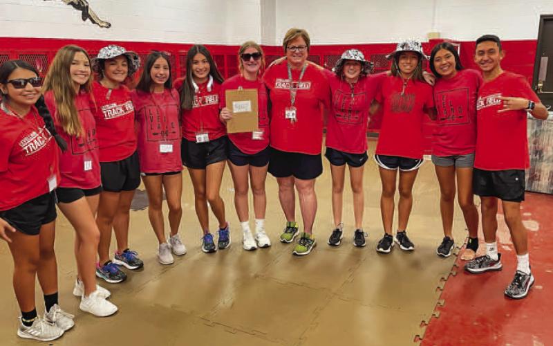 LOVE FOR HER STUDENTS - Levelland High School teacher and coach for track and cross country Nelda Munoz shared that she will miss being a part of students lives and working toward making them the best person they can be. Munoz stated that she took pride in prioritizing not only her student-athletes but the students she had in class who were willing to work hard. Pictured are a group of Munoz’s former students imitating Munoz during a themed school day. (Photo courtesy of Nelda Munoz)
