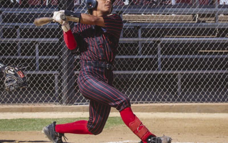 POWER SWING - Levelland Lobo Noah Tienda hit the ball May 2, in Snyder for the team’s last game of the season against the Brownwood Lions. (Staff photo by Aalijah Soliz)