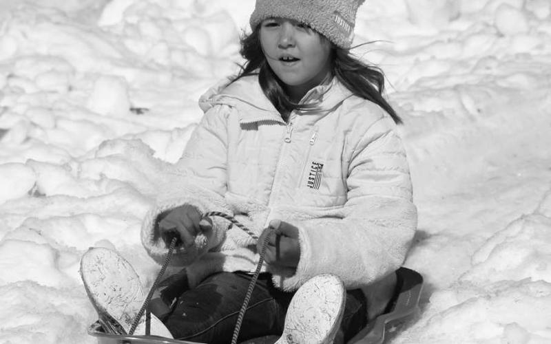 BLAZING SNOW TRAILS - Kids from around the surrounding areas got to experience some fun in the snow at the Lobo Lake Sled Hill Tuesday through Thursday. (Staff Photo)