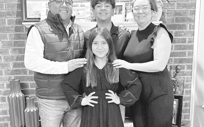 NEW COACH- Nathan Flores took the new assistant coach job at Ropes. Flores will be coaching basketball, football, and mainly baseball. Pictured above is Nathan Flores, Leandra Flores, Elijah Flores, and Emmie Flores. (Submitted Photo)