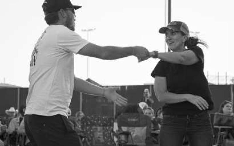 MOVING TO THE BEAT - This couple was dancing it out on the dance floor at the Cotton and Crude festival on Saturday night at the Oxy Sport Complex while they listened to the openers before Randall King took the stage. (Staff by photo by Hannah Woodrum)