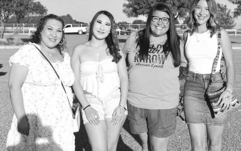 SATURDAY NIGHT LIGHTS - Lucy Garcia, Bella Garcia, Jessica Garcia and Jaelyn Garcia were dressed to the tens as they waited to see Randall King at the Cotton and Crude festival on Saturday at the Oxy Sports Complex. (Staff photo by Hannah Woodrum)