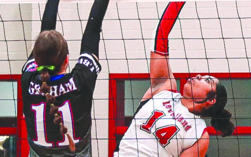 TOUGH TO STOP - Levelland Loboette Trinity Wafer spiked the ball at the Graham defense this past Monday in Colorado City during the team’s last game of the season. (Staff photo by Aalijah Soliz)