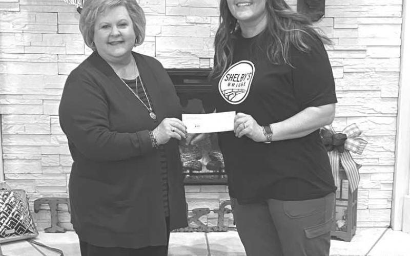 DONATION TO SHELBY’S WAY-- Progressive Women’s Club recently presented a donation to Shelby’s Bridge in support of the work they do to enrich life experiences for student’s with disabilities. Presenting the check to Shelby Lippold was club member, Lynette Major. Shelby’s Bridge is a non-profit, educational organization. (Photo Courtesy by Lynette Major)