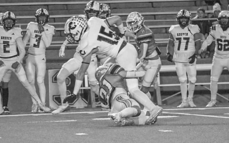 DOWN YOU GO - Ropes Eagle Kolter Dockery made the great effort tackle on the Gruver ballcarrier during the team’s last game of the season in Canyon. (Staff photo by Aalijah Soliz)