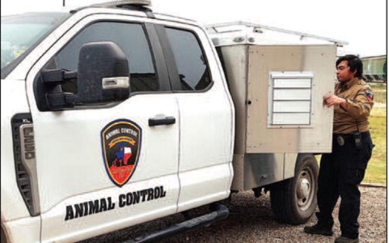 FIRST RESPONDERS-- Levelland Animal Control Officer Taylor Perez helps enforce laws regarding stray, dangerous, nuisance and unwanted domestic animals as well as investigating complaints, patrolling assigned areas, capturing animals and performing other duties related to humane animal protect and control. (Staff photo by Lynda Work)