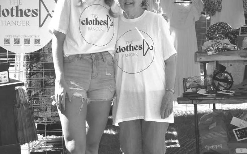 HANGING WITH GRANDMA- The Clothes Hanger Booth was one of the both’s that participated on Saturday in Sundown at the Oil Patch Day event, The Cloths Hanger was owned by Patsy Ford for 30 some years, grandmother to Caycee Holson. A two generation business that is now owned by granddaughter Caycee and pictured is Caycee Holson and Patsy Ford. (Staff photo by Emily Campos)