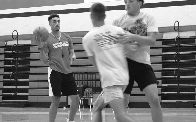 FIRST PRACTICE- The Levelland Lobo basketball program has entered a new era under Levelland Head Coach Jordan Windholz as he begins building his program this summer. Pictured is coach Windholz with Lobos Ben Alvarado and Kysen Niblett. (Staff Photo by Aalijah Soliz)