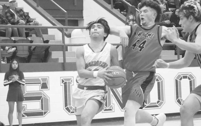 DOWNHILL - Sundown Roughneck Jay Martinez brought the ball down court during the teams contest against the New Home Leopards this past week at home. The Roughnecks will face off against the Tahoka Bulldogs this Friday at home. (Staff photo by Aalijah Soliz)
