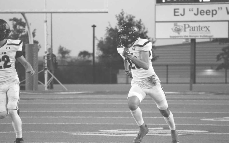 KICK-OFF - Levelland athlete Rance Massey ran down the field to make the tackle on the Borger Bolldog defender this past Friday at Bulldog Stadium. The Lobos played against the Seminole Indians this Friday for the teams last district game of the season. (Staff photo by Aalijah Soliz)