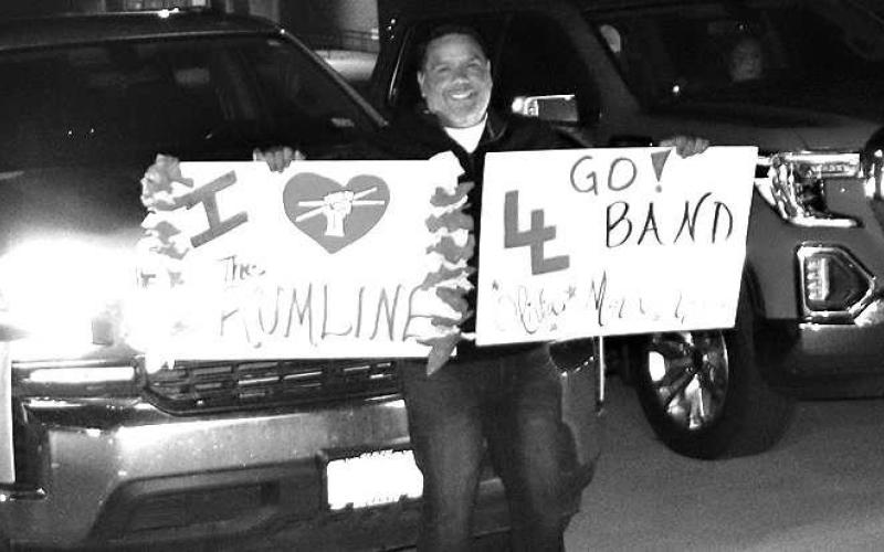 SHOWINGSUPPORT-- Jacob Velardez showed up early Saturday morning for the Levelland High School Lobo Band sendo-off to Abilene for UIL Marching Contest. He was among several families who come out to show support of the Lobo band. Jacob is the father of Olivia Velardez, who plays in the Lobo drumline. (Staff Photo by Shawn Franklin)