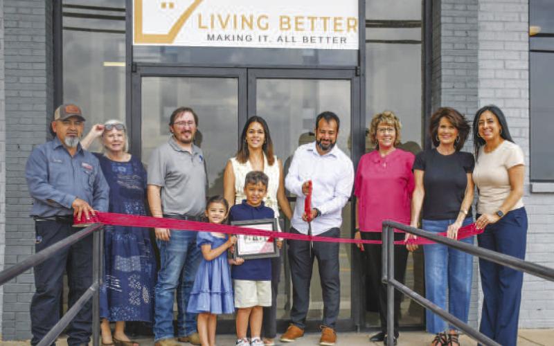 LIVING BETTER - The Levelland Chamber of Commerce held a ribbon cutting ceremony welcoming the newly opened Living Better Apartments, May 29. Pictured from left to right are: Freddy Ruiz, Donna Wheeler, Tony Montegna, the Forte family, Mary Siders, Cristal Isaacks and Lorie Marquez were all present for the Living Better ribbon cutting. (Hannah Woodrum)