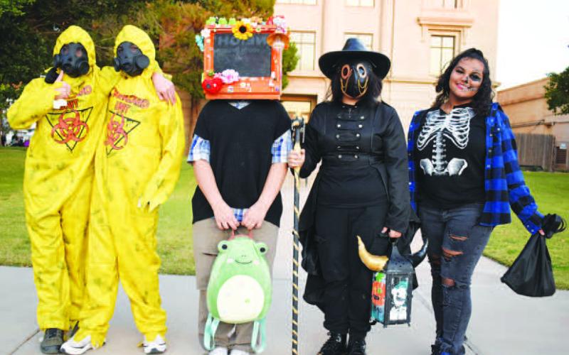 HANGINGOUTWITHFRIENDS - The City of Levelland Main Street program hosted the annual Trunk or Treat event Monday on the square. Israel Ayala, Jacob Ayala, Navaeh Blair, Stephanie Sanchez and Layni Sanchez show off their wicked costumes outside of the courthouse. (Staff Photo by Delany Jackson)