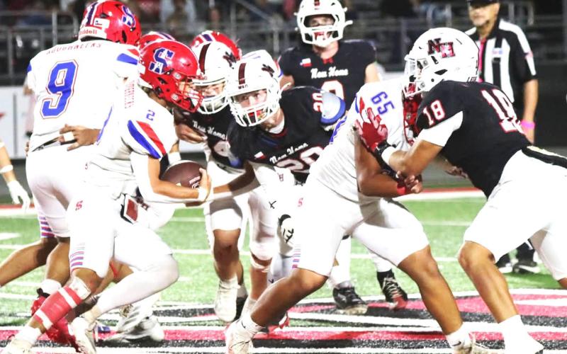 Sundown Roughneck Corey Goodman on the move as the New Home defenses press down. (Sundown ISD photo)