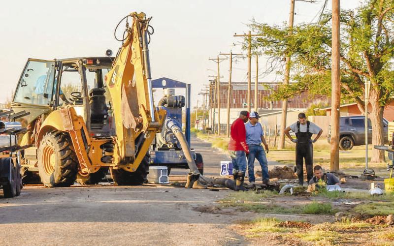 WATER LINE REPAIR - The public works department for the City of Levelland had a crew respond to a water leak Wednesday night after a fire hydrant was hit and caused damaged to the line on the corner of Rose Avenue and West Adams Street near Carver. The crew worked on repairing the line throughout the night before wrapping up repairs Thursday morning. (Photo courtesy of Emily Campos)
